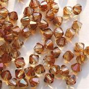 BICONO 4MM CRYSTAL COPPER           (ART.5301 SWAROVSKI ROMBETTO)