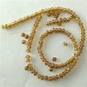 CRISTALLI 2x3MM TOPAZIO BRUCIATO FACCETT.CINA IN FILO (120 pz.CIRCA)